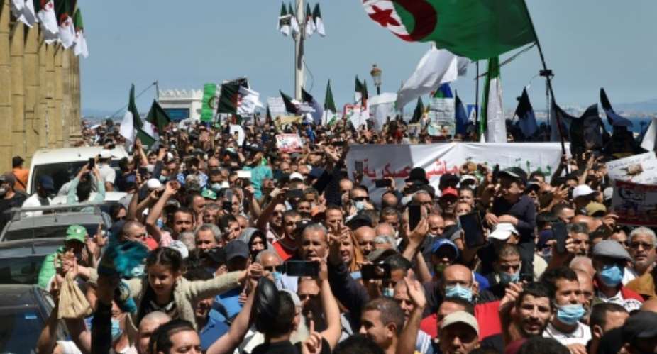 Algerians shout slogans during an anti-government demonstration in the capital Algiers on April 30, 2021.  By RYAD KRAMDI AFP