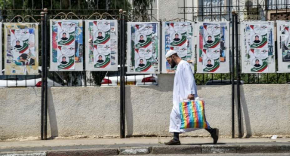 Algerians vote in parliamentary elections on Saturday although opposition activists have called for people to boycott the poll.  By RYAD KRAMDI AFP