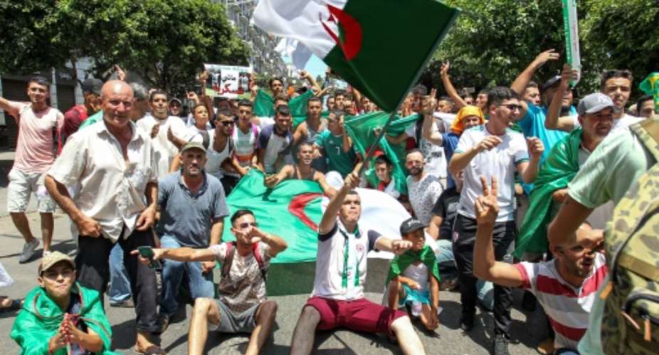 Algerians were back on the streets Friday for anti-government protests boosted by anticipation as the national team prepares to battle Senegal in Cairo in the Africa Cup of Nations final.  By - AFP