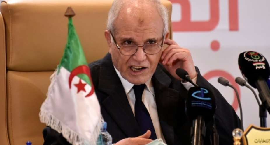 Algeria's electoral board chief Mohamed Chorfi praised a vote held 'in total freedom and transparency' despite record low turnout.  By RYAD KRAMDI AFP