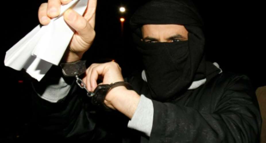 Ali Charaf Damache of Algeria arrives in court in Waterford, Ireland on March 15, 2010.  By Peter Muhly AFPFile