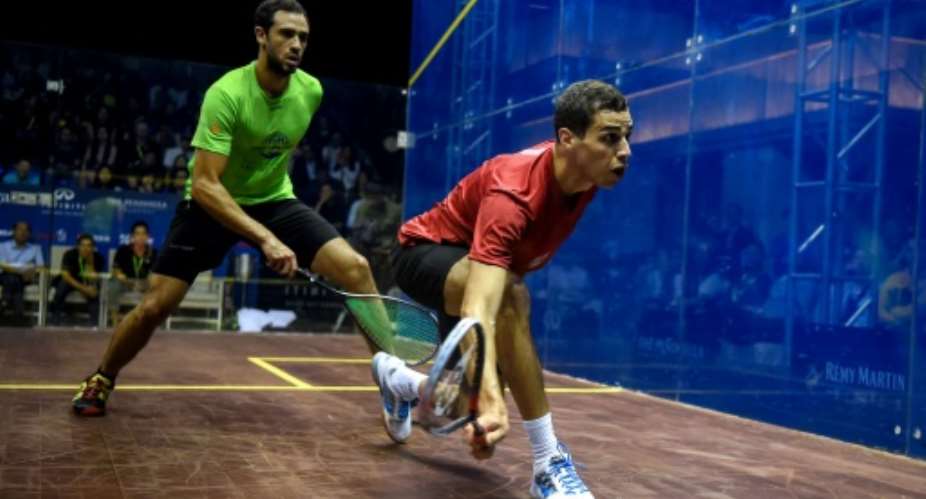 Ali Farag of Egypt R, pictured in action in September 2017, joined his wife Nour El Tayeb in the last four of their respective championships -- the first time a married couple have achieved this.  By CHANDAN KHANNA AFPFile