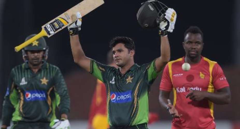 Pakistan's captain Azhar Ali C celebrates after scoring a century as teammate Haris Sohail L and Zimbabwe bowler Brian Vitori R look on during the second One Day International ODI cricket match in Lahore on May 29, 2015.  By Aamir Qureshi AFP