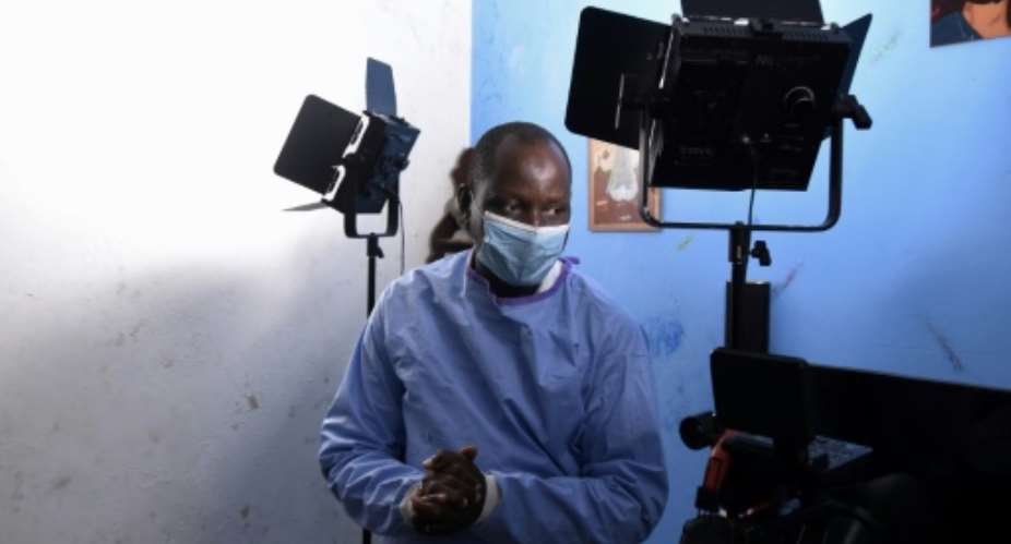 Alioune Thiam, who plays Dr. Diouf in a Senegalese TV show, 'The Virus'.  By Seyllou AFP