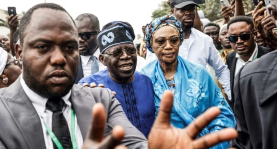 All Progressives Congress APC presidential candidate Bola Tinubu C-L has taken an early lead.  By John Wessels AFP