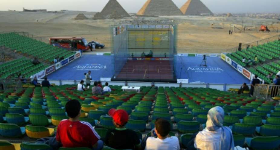 All-glass court is set alongside Egypt's famous pyramids of Giza before the final match of the Al-Ahram World Open Squash Championship, in 2006.  By KHALED DESOUKI AFPFile