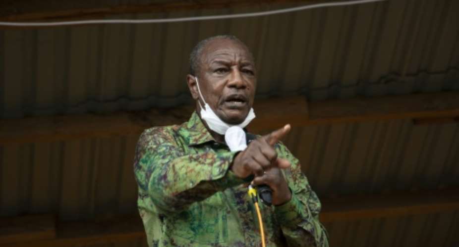 Alpha Conde argued that the new constitution will help modernise Guinea.  By CAROL VALADE AFPFile