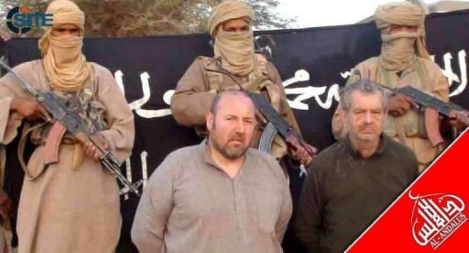 A SITE Monitoring Service photo shows two Westerners kidnapped by Al-Qaeda.  By  AFPSITE Monitoring Service