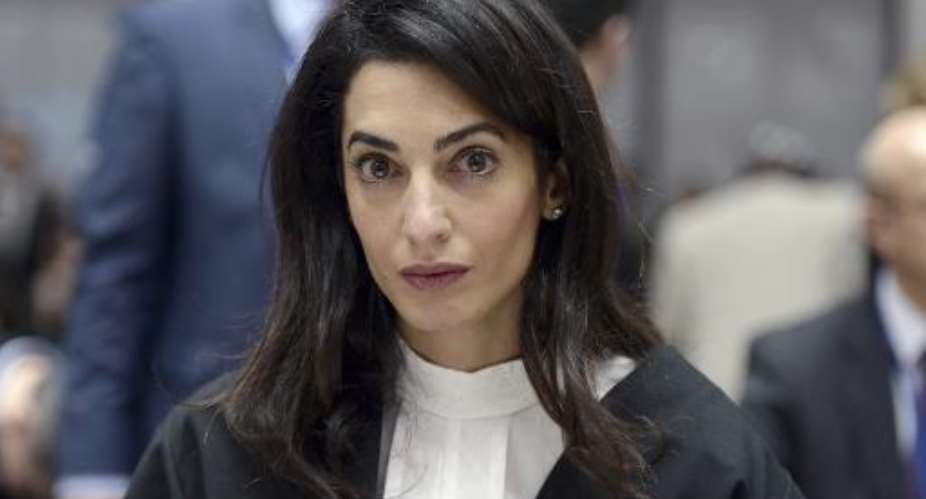 Lawyer Amal Clooney waits on January 28, 2015 for the start of a hearing before the European Court of Human Rights in the eastern French city of the Strasbourg.  By Frederick Florin AFPFile