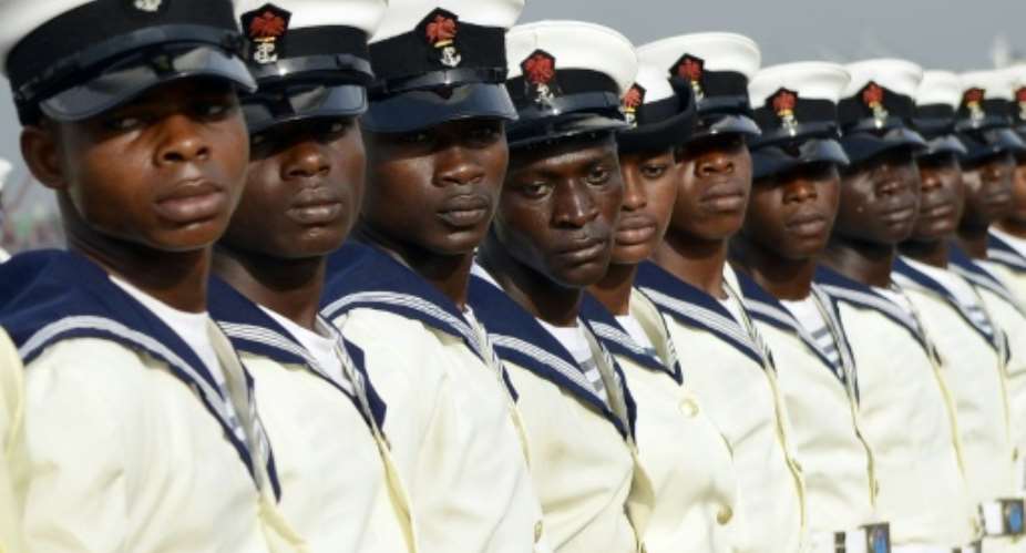 Nigerian marines attend the commissioning ceremony of the NNS Centenary, an offshore patrol vessel built by Chinese Shipbuilding and Industry Corporation CSIC for Nigerian Navy, on February 19, 2015 in Lagos.  By Pius Utomi Ekpei AFPFile