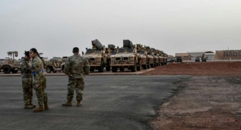 American soldiers prepare to board a cargo plane in Niamey on June 7, 2024 as US forces leave Niger.  By BOUREIMA HAMA (AFP/File)