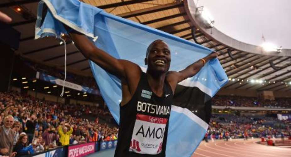 Botswana's Nijel Amos celebrates winning the final of the men's 800m athletics event at Hampden Park during the Commonwealth Games in Glasgow, on July 31, 2014.  By Ben Stansall AFP