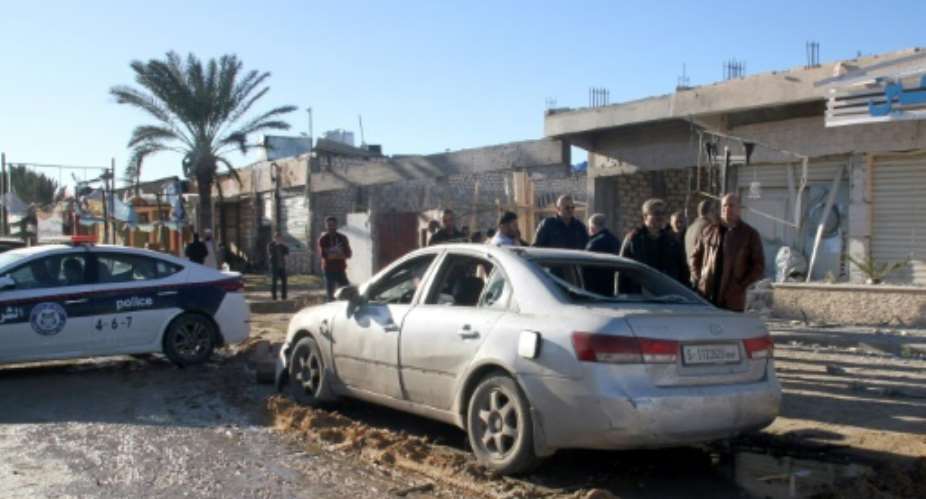 An air strike in Zawiya near the Libyan capital Tripoli hit a pharmacy, a bakery and cars parked on the street, the mayor of the town said.  By - AFP