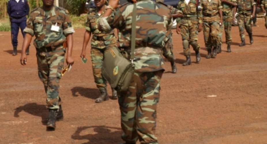An Angolan sergeant, similar to the soldiers pictured here in 2012, has been jailed after shooting a boy during an August 2016 demonstration against the demolition of houses for an industrial project.  By ALFA BALDE AFPFile