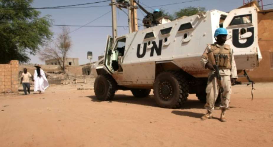 An armoured personnel carrier of The United Nations Multidimensional Integrated Stabilization Mission in Mali MINUSMA is parked in Timbuktu on September 19, 2016.  By Sebastien Rieussec AFPFile
