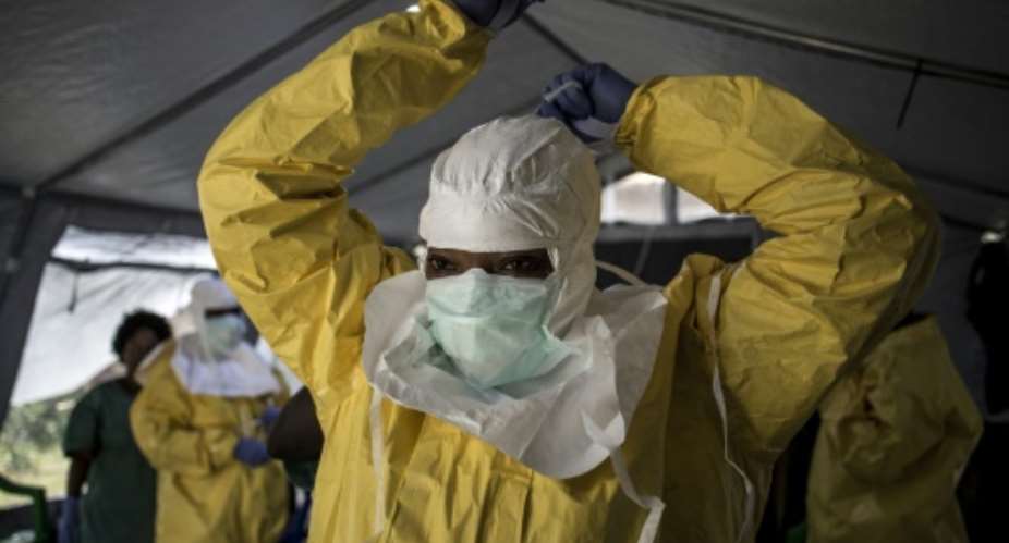 An Ebola worker in DR Congo dons full protective gear against the lethal virus.  By John WESSELS AFP