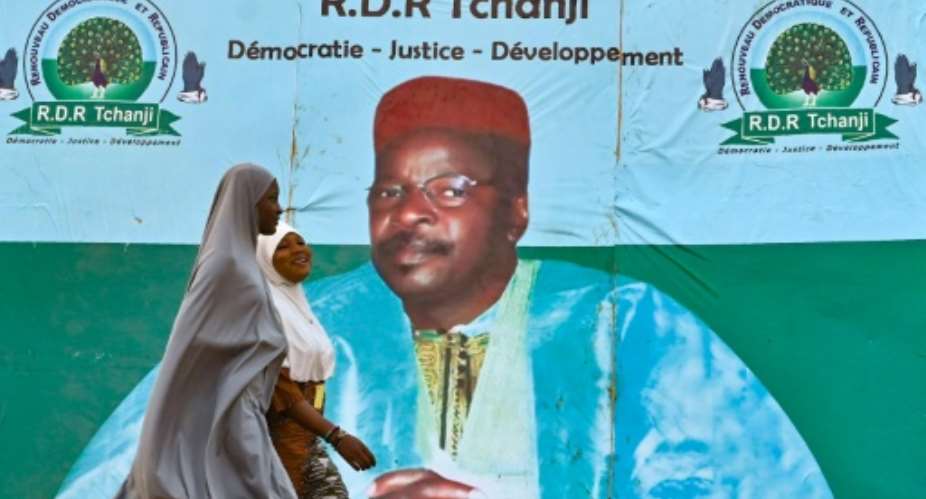 An election campaign poster for opposition leader Mahamane Ousmane in Niamey. Ousmane says he won Sunday's runoff, although official results say he lost by more than 11 percentage points.  By Issouf SANOGO AFP
