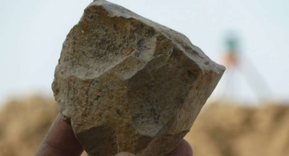 An Oldowan core stone tool freshly excavated at Ain Boucherit from which sharp-edged cutting flakes were removed.  By Mohamed SAHNOUNI Mohamed SahnouniAFP