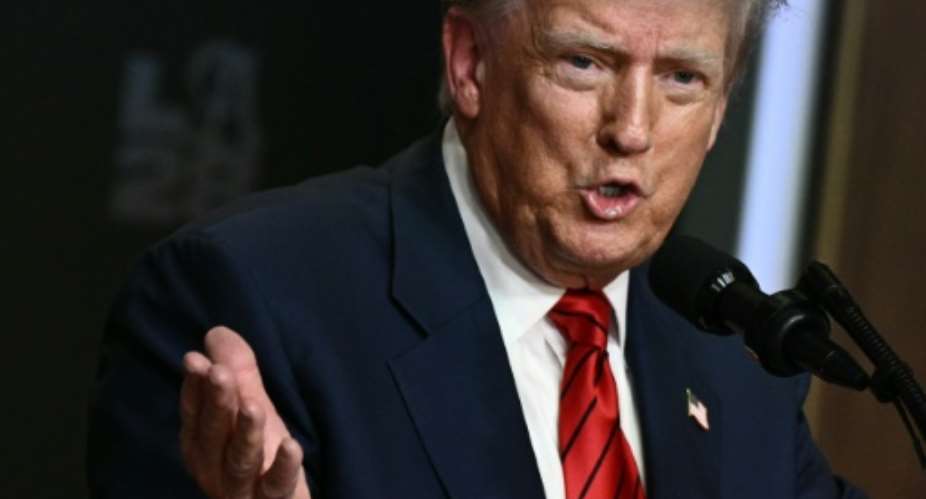 An order by President Donald Trump, raising tariffs on dozens of trading partners, took effect Thursday.  By Brendan SMIALOWSKI (AFP/File)