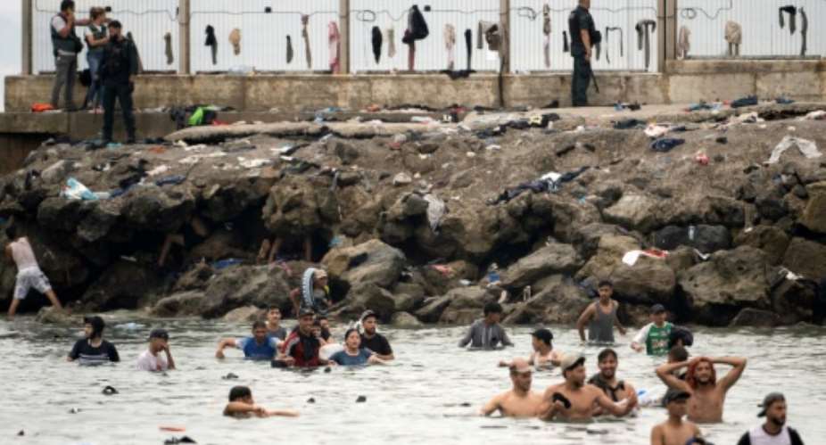 An unprecedented 72,000 people poured into Ceuta from Morocco from July 30, mostly by swimming.  By JORGE GUERRERO (AFP)