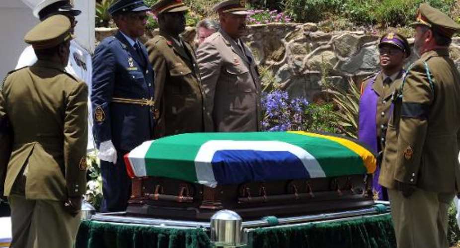 The coffin of South African former President Nelson Mandela at his burial site in Qunu on December 13, 2013.  By Edmond Jiyane Government HandoutAFPFile