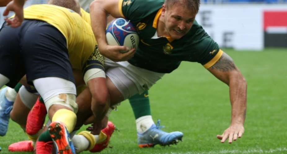 Andre Esterhuizen (R) playing for South Africa against Romania in the 2023 Rugby World Cup in France..  By ROMAIN PERROCHEAU (AFP)