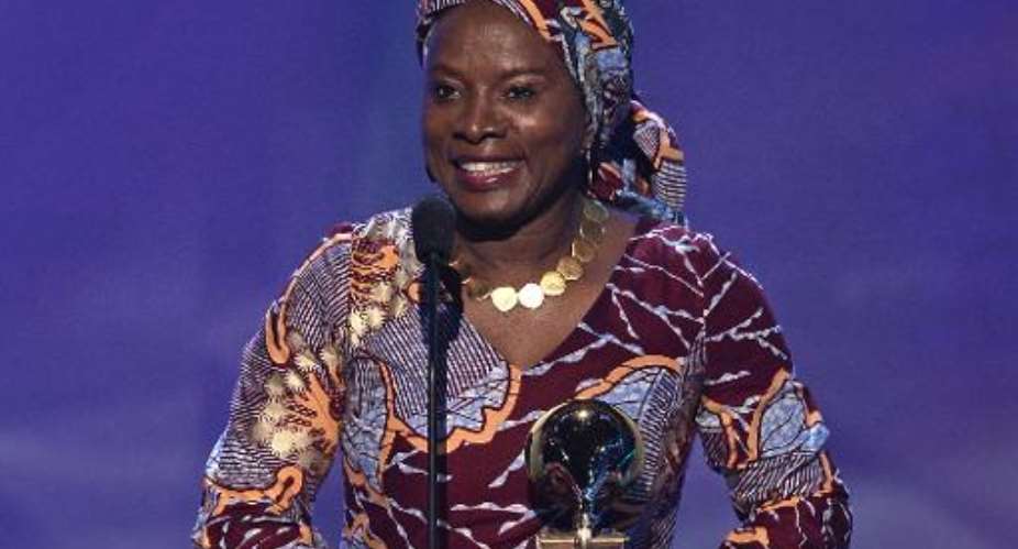 Winner for Best World Music Album Angelique Kidjo addresses the crowd on stage at the 57th Annual Grammy Awards in Los Angeles February 8, 2015.  By Mladen Antonov AFP