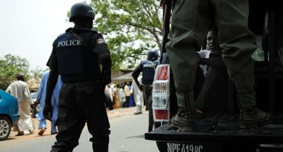 Nigeria police stand guard in Bauchi on April 28, 2011.  By Tony Karumba (AFP/File)