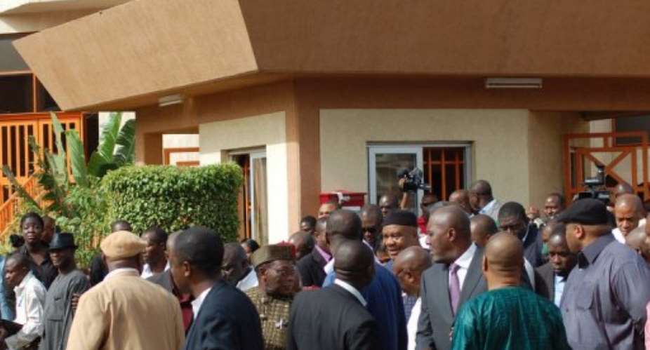 People wait in 2010 outside the courthouse.  By Emmanuel Wole (AFP/File)