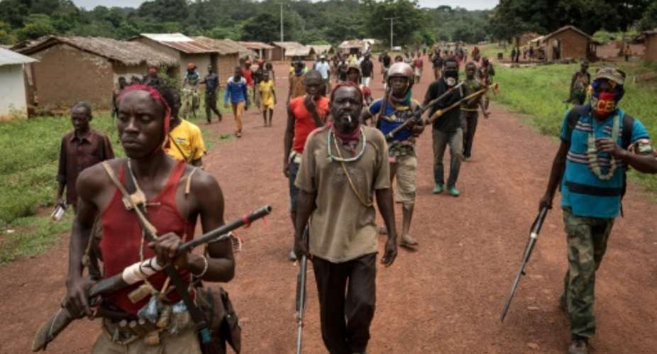 Antibalaka fighters walk in Gambo, southeast Central African Republic, on August 16, 2017.  By ALEXIS HUGUET AFPFile