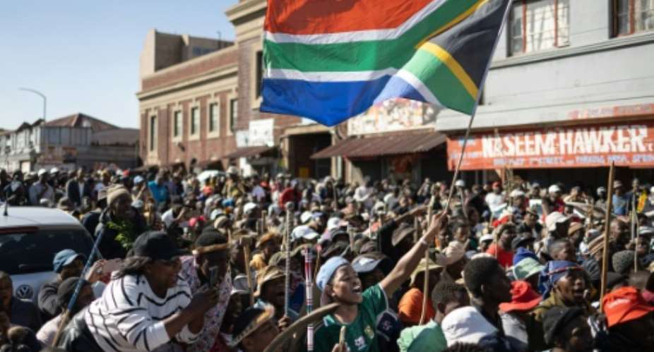 Anti-migrant protesters marched in a township outside Johannesburg.  By EMMANUEL CROSET (AFP)