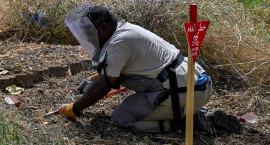 Anti-mine teams have cleared thousands of explosives from around Sudans capital.  By Khaled DESOUKI (AFP)