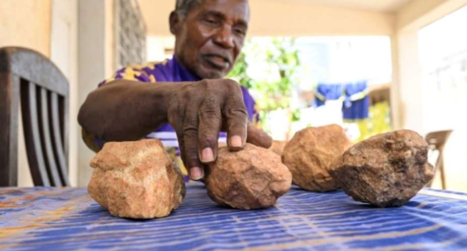Archaeologist Francois Guede Yiode keeps the prehistoric stones in his home.  By Issouf SANOGO (AFP)