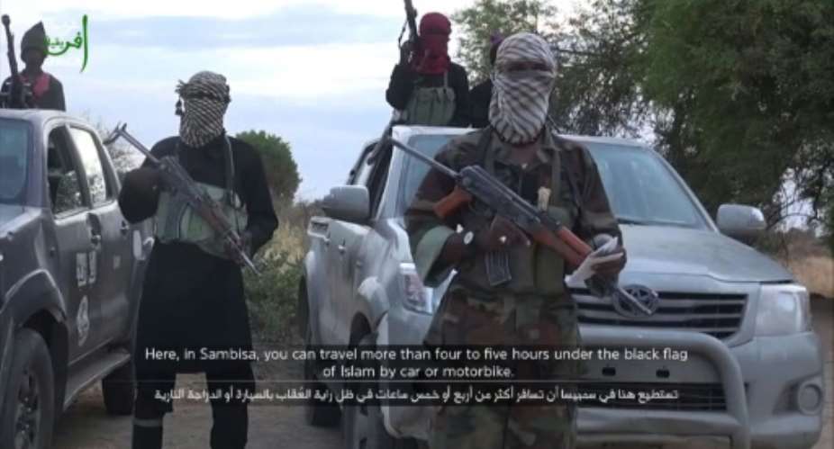 A grab taken from a video posted on YouTube on June 2, 2015 by Boko Haram shows an alleged group member delivering a speech at an undisclosed location.  By  YouTubeAFPFile