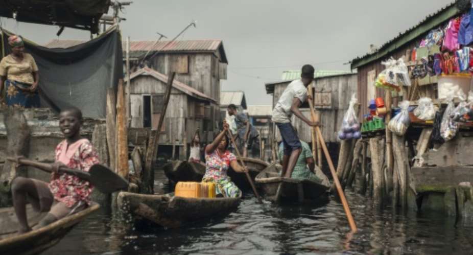 Around a quarter of a million people live in Makoko -- it is believed to be the biggest floating community in the world.  By STEFAN HEUNIS AFP