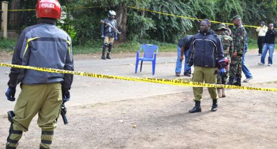File picture taken on July 8, 2014 shows police cordoning off the site of a bomb attack in Arusha, northern Tanzania.  By  AFPFile