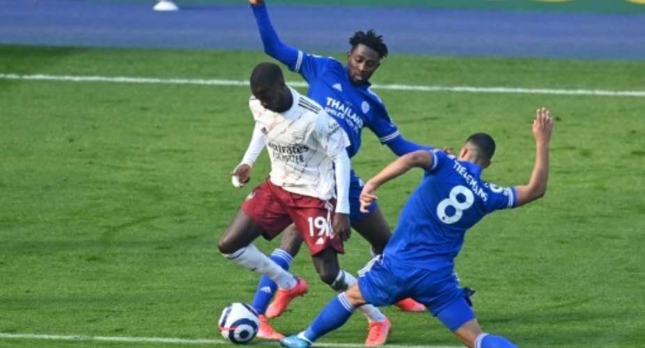 Arsenal winger Nicolas Pepe L is fouled during his outstanding performance against Leicester City at the weekend.  By Michael Regan POOLAFP