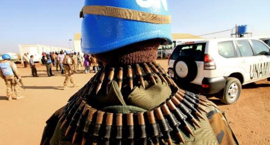 UN peacekeepers secure an area in Nyala, the capital of South Darfur state on November 30, 2010.  By Ashraf Shazly AFPFile