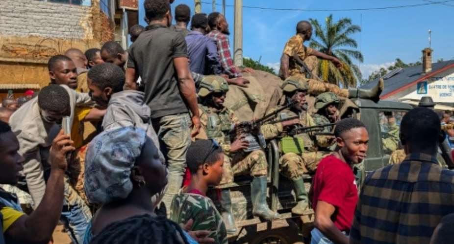 As they entered Bukavu, M23 fighters were applauded by some residents on the streets or huddled on balconies.  By Amani Alimasi (AFP)