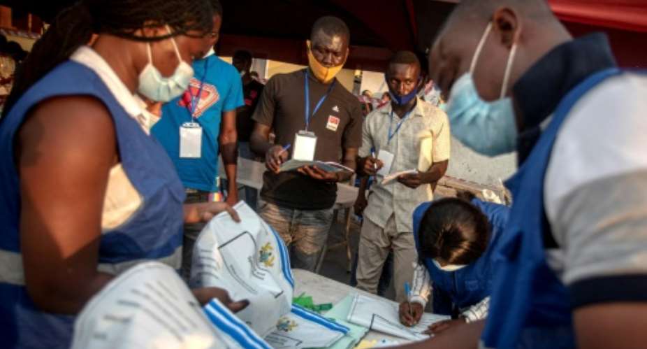 At a polling station in Accra's Jamestown neighbourhood, dozens of election staff spent the night counting ballots while party officials, journalists and election observers watched, some half asleep.  By CRISTINA ALDEHUELA AFP