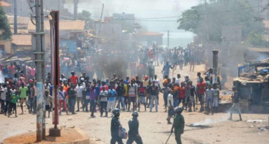 At least a dozen people were killed in post-election protest violence, before talks started between the opposition and the government.  By CELLOU BINANI AFPFile