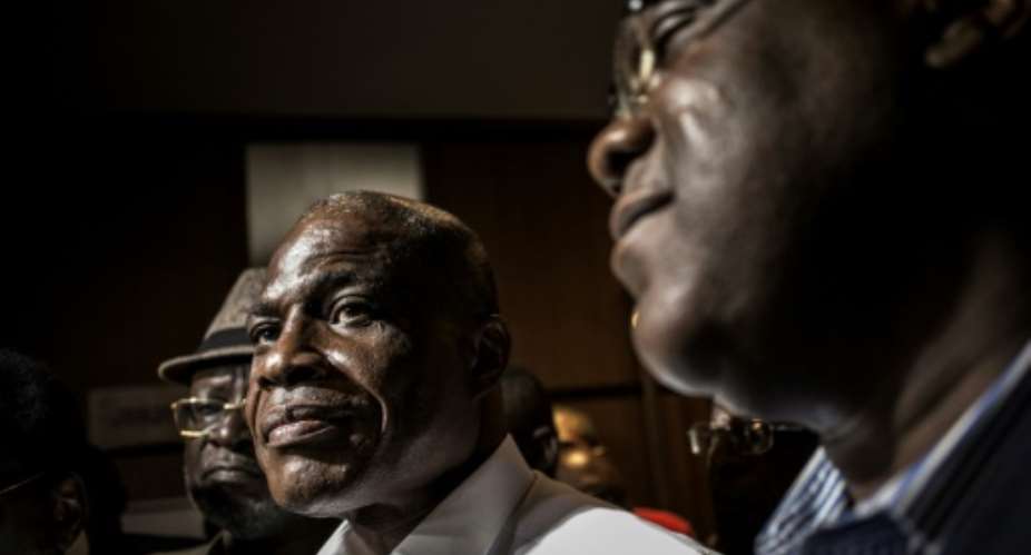 At odds: Martin Fayulu left and Felix Tshisekedi pictured at talks with the African Union in Kinshasa on January 2.  By John WESSELS AFP