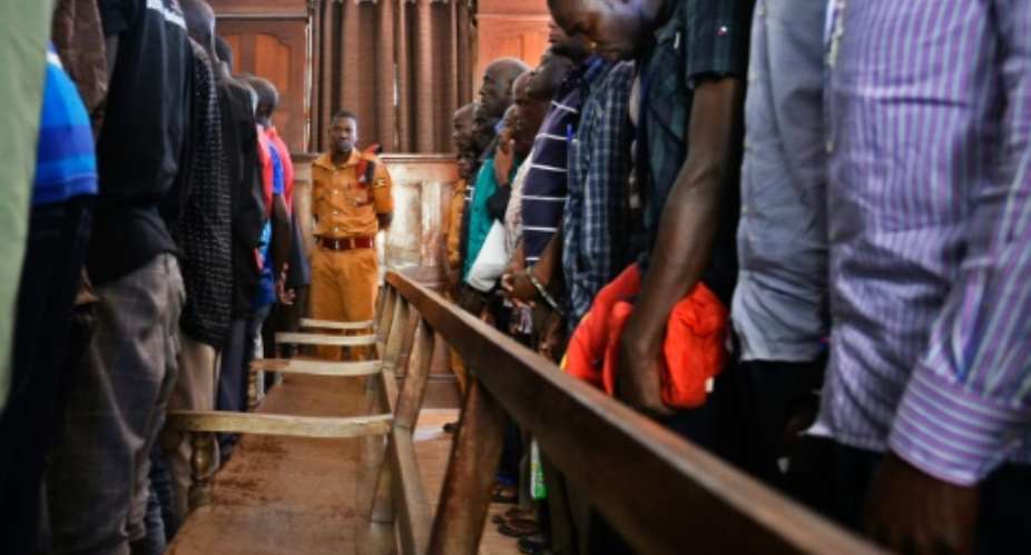At the first hearing in the capital Kampala dozens of male suspects in sexual violence cases filed into court, chained two-by-two, to appear before Lady Justice Jane Frances Abodo.  By Isaac Kasamani AFPFile