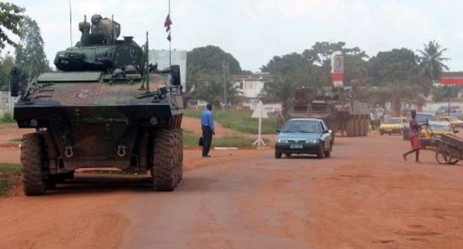 French Sangaris troops patrol in a military vehicle on August 16, 2014 in Bangui, CAR.  By Pacome Pabandji AFPFile