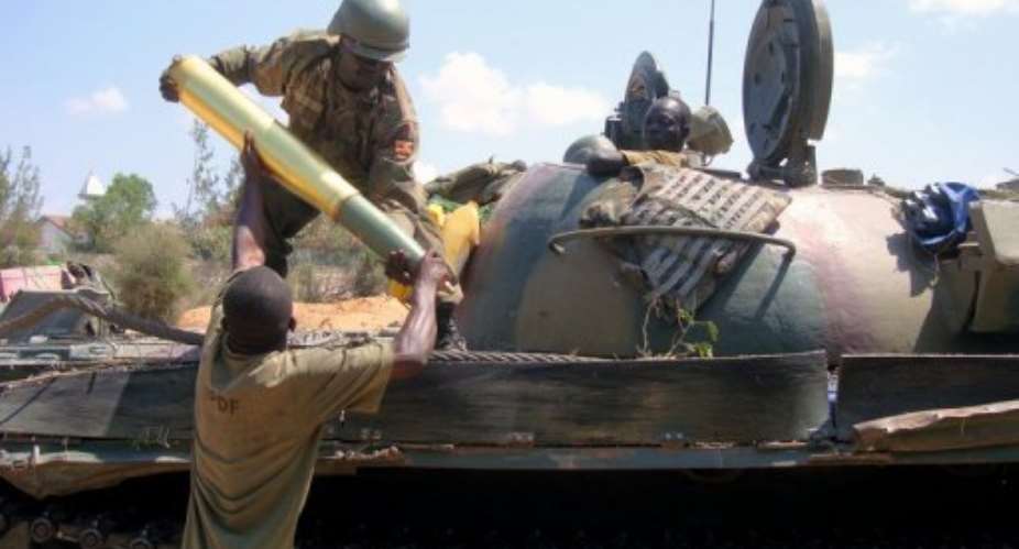 African Union soldiers load a tank shell in Somalia.  By Mohamed Abdiwahab AFPFile