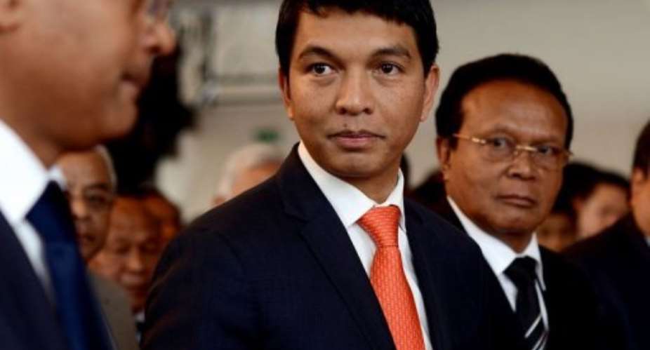 Madagascars transitional leader Andry Rajoelina (C) attends a ceremony at Antananarivos Town Hall, on May 13, 2013.  By Bilal Tarabey (AFP/File)