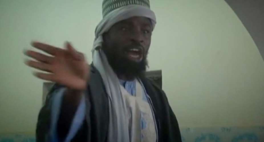 A screengrab from a video released by the Nigerian Islamist group Boko Haram shows its leader, Abubakar Shekau, preaching to locals in an unidentified town.  By  Boko HaramAFPFile