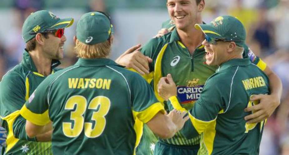 Australia's Josh Hazlewood 2nd R is congratulated by teammates after taking the wicket of South Africa's Faf du Plessis during the second ODI in Perth on November 16, 2014.  By Tony Ashby AFPFile