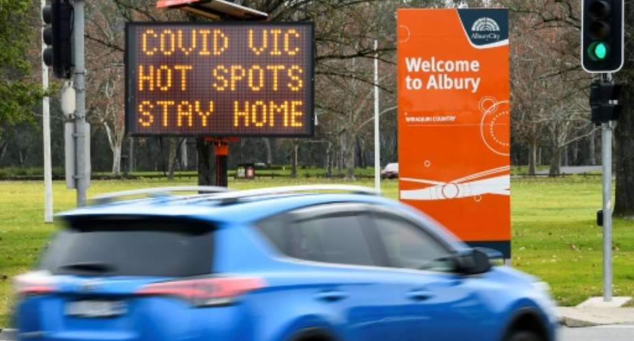 Australia has ordered millions locked down in its second-biggest city, and effectively sealed off Victoria state to combat a new coronavirus surge.  By William WEST AFP