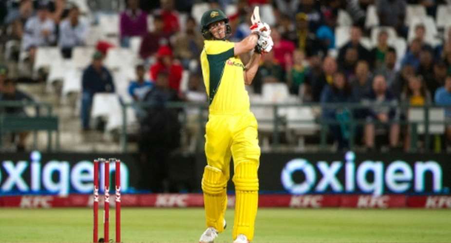 Australian batsman Mitchell Marsh plays a shot to win the third and final T20 cricket match against South Africa at the Newlands Stadium in Cape Town on March 9, 2016.  By Rodger Bosch (AFP)